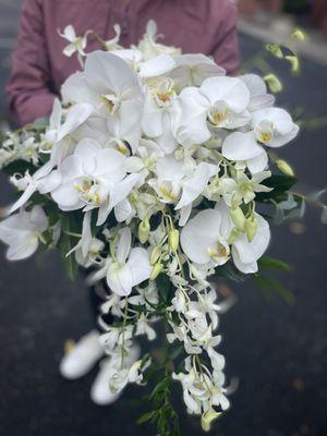 Cascading Bridal bouquet with orchids   We deliver to all the wedding venues in Portland and surrounding area including wineries