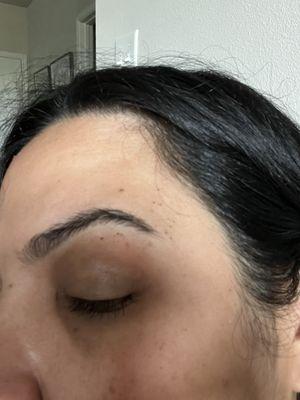 All the red spots around my eyebrows is skin she remove while threading my eyebrows. Do not go here.