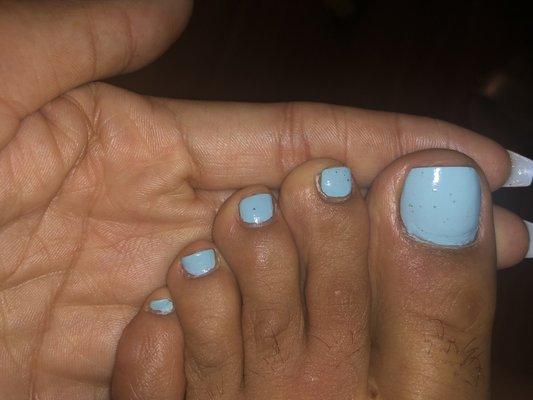 Horrible job with cleaning my nail & sloppy polish. This is the day after my pedicure. Excuse mg hair toes lol