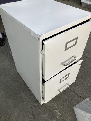 This is the filing cabinet that the movers of Big Burns Moving told me to just "pound out the damage with a hammer"