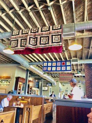 Quilts hanging from the rafters