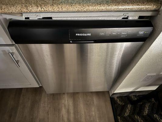 Broken enclosure around dishwasher