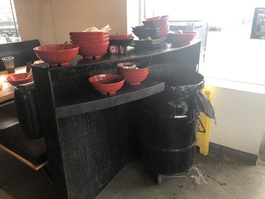 Stacks and stacks of dishes at each bin.