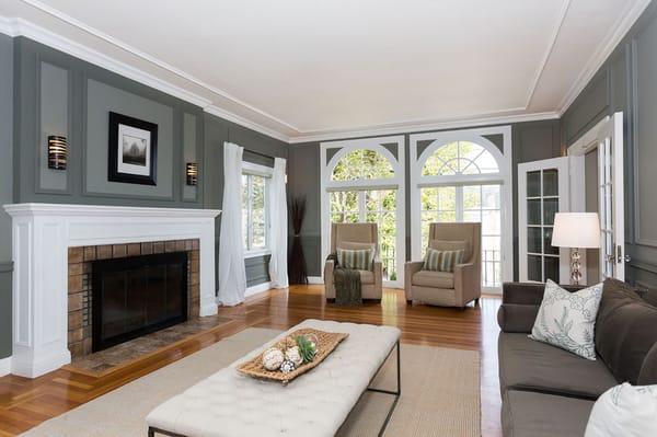 Sunning Living Room with Period Details and a wood-burning Fireplace