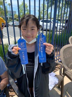 First places on her back stroke and free style!