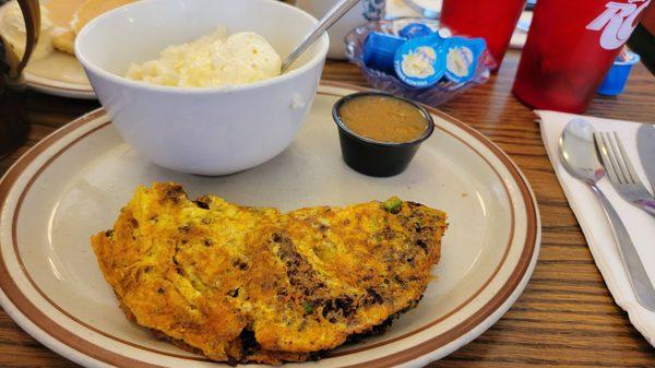 Chorizo omelette w/ grits