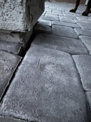 Gap and lifted paver stone