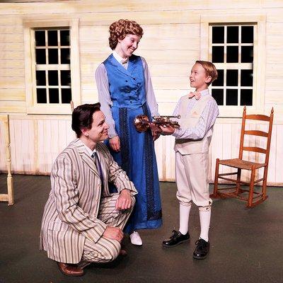 Katy Merriman as Marian Paroo, Brad Church as Professor Harold Hill, and Jack Gabby as Winthrop Paroo (The Music Man)