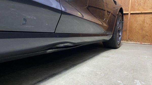 Dent in passenger side rocker panel