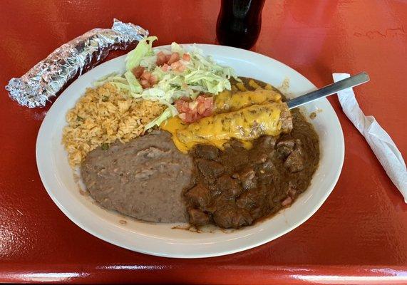 Texas Plate: 12.99  Two chicken enchiladas, carne guisada, rice and beans with a Mexican coke ($3.00)