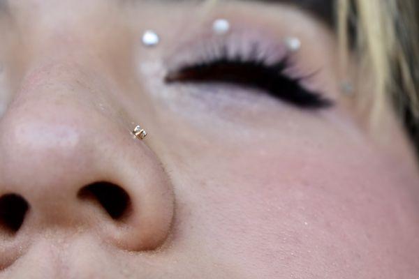 Genuine diamond and 14k gold nose piercing