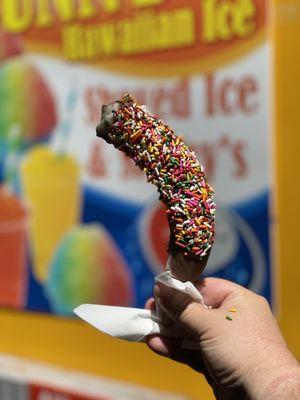 Chocolate covered banana with sprinkles