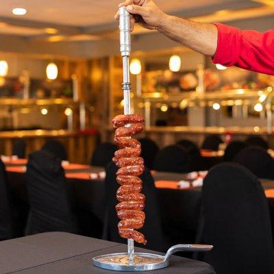 12 different types of meat which are presented on skewers and carved table side. www.cafemineirosteakhouse.com