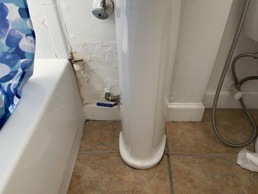 This is what the wall looked like before the repair. You can see the rot on the left close to the bathtub.