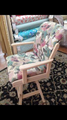 The before pic of the chair that was upholstered in the nautical anchors