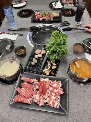 Hot pot with Tom yum broth and heathy herb broth  Korean barbecue