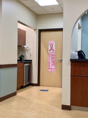 The waiting room, looking towards the entrance to treatment area (and mini-fridge that held water for patients pre-pandemic).