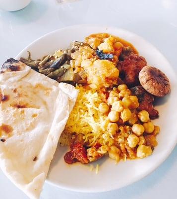 Vegan lemon rice, aloo gobi and channa, bhindi; mattar paneer, pakora, aloo tiki and naan