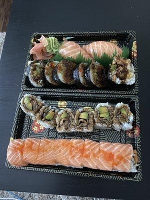 Salmon nigiri, spider roll, eel and avocado roll, and salmon love roll.