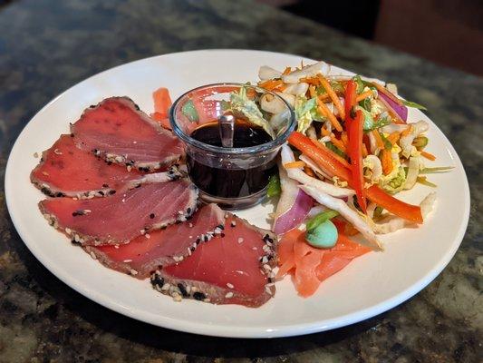 Sesame seed-encrusted tuna sashimi with Asian vegetable slaw and soy ginger dipper sauce