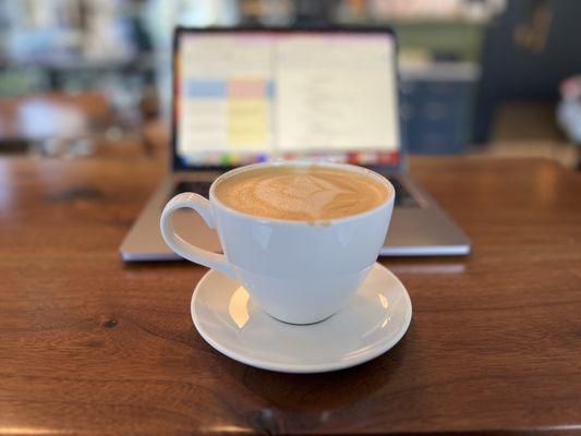 Dirty chai and a laptop on the bat at Pour