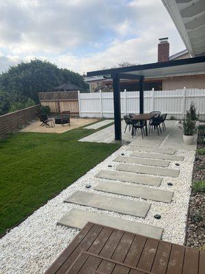 Pergola with lighting, stepping stones, deck