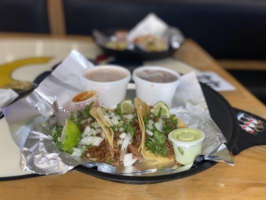 Carnitas Street Tacos with rice and beans.