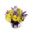 Beautiful flowers in a wicker basket. Great for fall or spring time arrangements