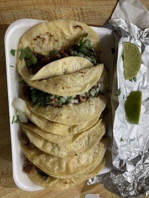 Steak tacos with cilantro and onion