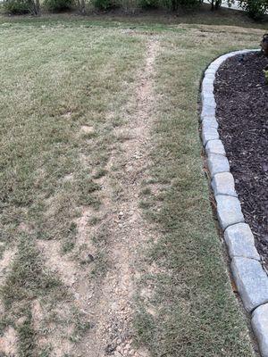 Trench left uneven and sod not replaced.