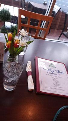 Table with small bouquet of fresh flowers.