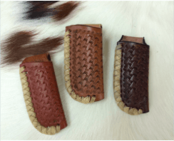 Basket Weave, rawhide laced Knife scabbards hand made by Ludwig's great leather crafters.