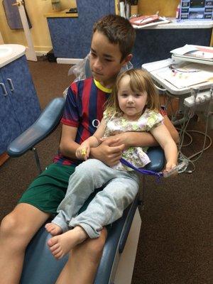 I love this dental office!  They let elly sit on her brother's lap for her first check up. Now she's a pro.