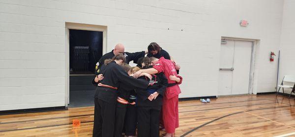 Our team praying at our most recent tournament