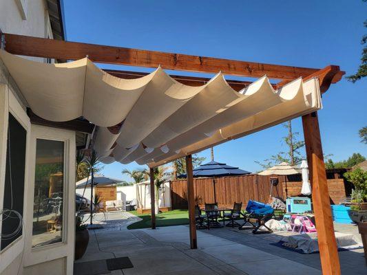 Redwood patio cover with retractable canvas. Brentwood Ca.