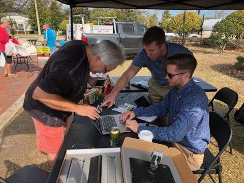 The Uptown Energy Solutions Team providing Free 60-second solar quotes to customers at the Farmers Market in Longwood, FL