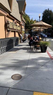 2/20/2023:  Mill Valley Market's Patrons eating their deli meals outside.