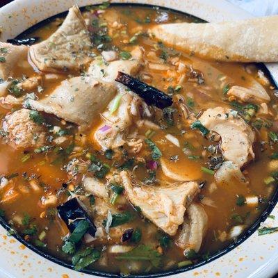 Menudo with a dipped corn tortilla.