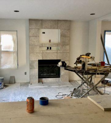 Family room tile being installed for chimney.  You can't tell from the picture, but it is beautifully polished!