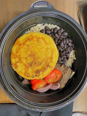 (1) Entrée: Skirt Steak Churrasco (2) Sides: Arepa and Beans with White Rice