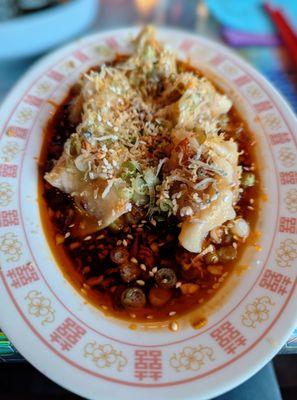 Pork and shrimp dumplings. Sambal tumia fried anchovy, cured egg yolk, pickled, scallion and sesame.