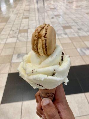 Single scoop stracciatella with salted caramel butter macaron