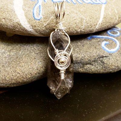 A wire wrapped crystal - part of the artistic wire wrapping services of the Healing Professor.