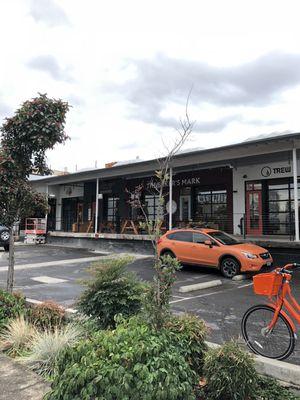 Exterior of Jimmy's Tire & Annex from 12th. Enter through the orange door by Finger Bang.