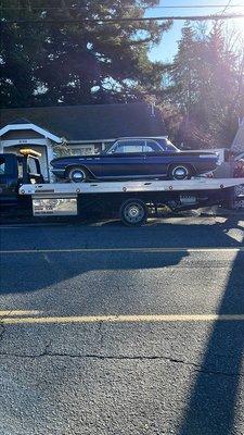 Patriot Towing driver Aaron taking care of customers classic buick