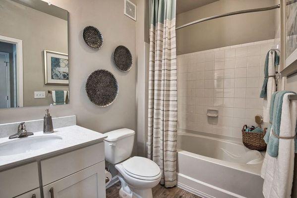 a bathroom with a sink toilet and a bath tub at Sterling Creek