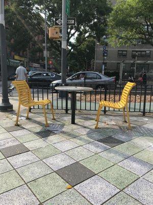 You can take your food out to the tables in the middle of Allen Street.