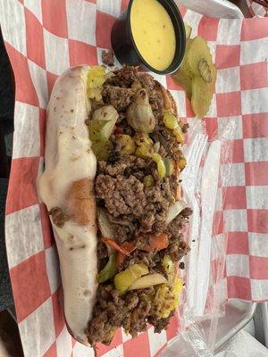 Steak and cheese with Pepperoncini's, green peppers, onions and provolone cheese. Homemade sauce on the side!!