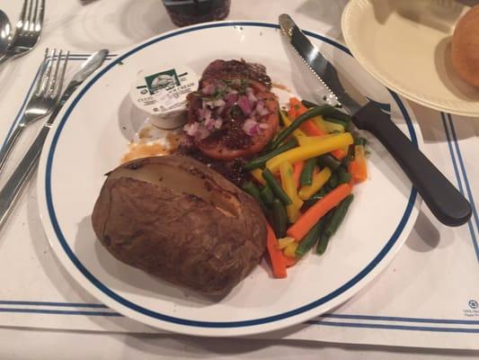 Steak with veggies and baked potato. Steak cooked medium rare as I requested and good.