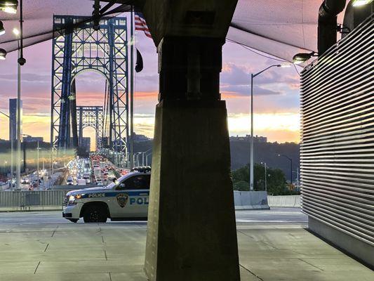 Police presence and sunset over over the GW.